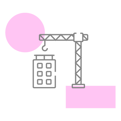 Construction crane lifting materials next to a commercial building representing construction management and project development